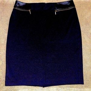 Black skirt with faux leather and gold zipper details